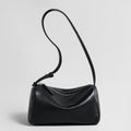 Soft Lambskin Leather Barrel Shoulder Bag – Curved-Zip Cylinder Design with Adjustable Crossbody Strap